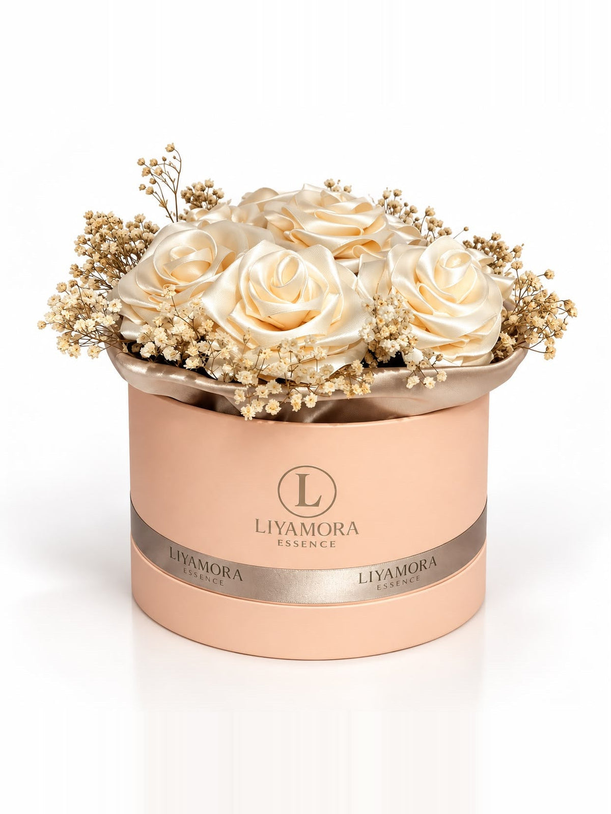 Scented Satin Rose Box by Liyamora Essence: peach-coloured box with gold print and a satin ribbon, filled with cream satin roses and dried gypsophila